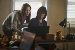 Robin and Pat looking at a laptop