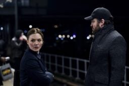 Strike and Robin standing next to each other at night