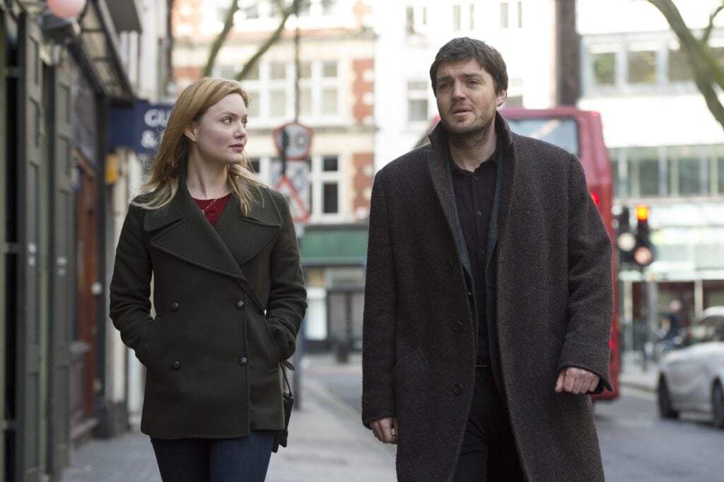 Strike and Robin walking in the street
