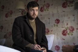 strike sitting in bedroom